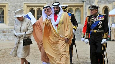 Queen Elizabeth, Sheikh Khalifa, and Prince Philip leave following the inspection of the Guard of Honour at Windsor Castle in 2013. Toby Melville / AP Photo