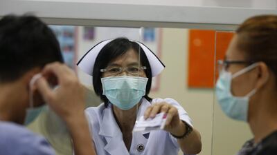 Thai nurse on duty wears a protective mask against Mers, at the screening of patients at the Bamrasbaradura Infectious Diseases Institute, Nonthaburi province, on the outskirts of Bangkok after Thailand identified its second case of the Middle Eastern Respiratory Syndrome. Narong Sangnak/EPA