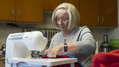 Barbara Evans converts old bedsheets, blankets and pillowcases into beautiful clothes and items for impoverished children around the world. Antonie Robertson / The National
