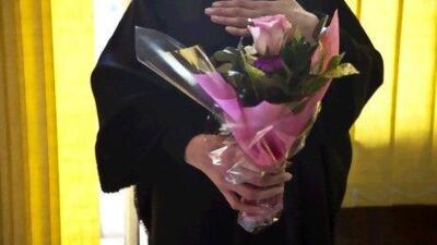 Sahar standing inside Kafa's offices. She is holding a flower bouquet given to her by the members of Kafa, one of several organisations pushing legislation in Lebanon to protect women from family violence. Matilde Gattoni for The National