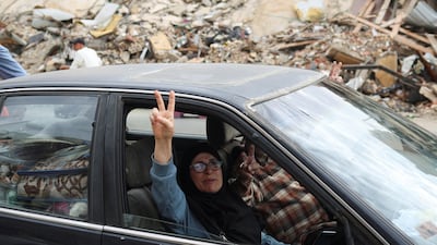 A defiant gesture as a Lebanese couple return to their home in the southern suburbs of Beirut after a 10-day ceasefire between Israel and Hezbollah came into effect. Reuters