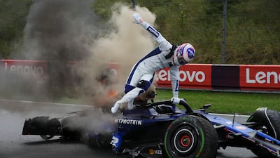 Williams driver Logan Sargeant jumps out of his car after a crash during the final practice before the Dutch Formula 1 Grand Prix in Zandvoort. AP