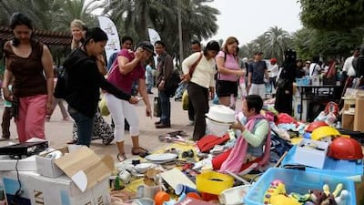 Bargain hunters peruse homeware items at the flea market in Dubai's Safa park.