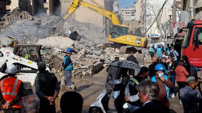 Rescue workers clear rubble from a building destroyed by an Israeli strike in the Bashura neighborhood of central Beirut, Lebanon, 18 March 2026. According to the Lebanese Ministry of Public Health, more than 912 people have been killed and 2,221 others injured in airstrikes across Beirut's southern suburbs and villages in southern Lebanon since renewed hostilities began. The Israeli military stated that it is conducting strikes across the country targeting Hezbollah infrastructure and personnel. EPA / WAEL HAMZEH