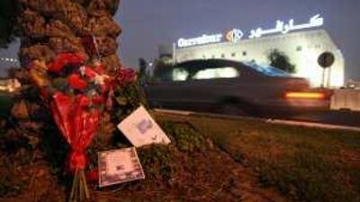 Floral tributes on the central reservation on Airport Road outside Carrefour in Abu Dhabi.