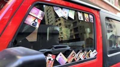 A man has been jailed after attacking a police officer who confronted him as he distributed massage service cards at Global Village. Pawan Singh / The National