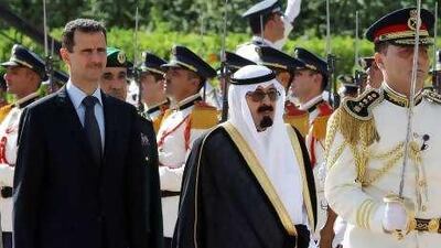 Syrian President Bashar al Assad, left, and King Abdullah of Saudi Arabia review the honour guards in Damascus yesterday.