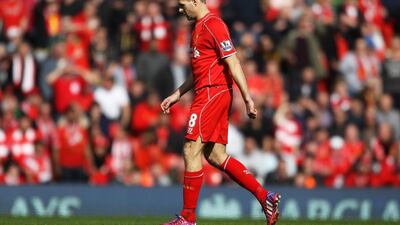 Liverpool captain Steven Gerrard leaves the pitch after being sent off during his side's Premier League loss to Manchester United on Sunday at Anfield. Peter Powell / EPA