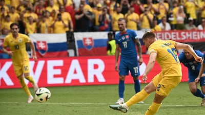 Razvan Marin scores from the spot against Romania. AFP