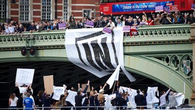 Campaigners to remain in the EU unfurl a banner on Westminster Bridge. Niklas Halle’n / AFP Photo