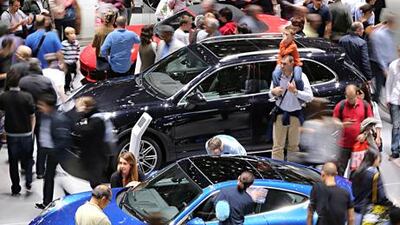 The Paris motor show opened last week with visitors outnumbered by car-industry demonstrators. Above, cars are displayed on the stand of the luxury sports car maker Porsche during the event. Thomas Samson / AFP