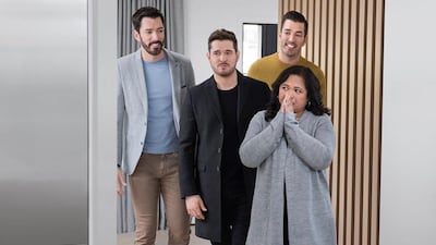 Michael Buble with Minette, in his grandfather's former home that he gifted to the Filipina caregiver. Property Brothers / Facebook