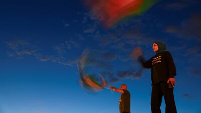 Demonstrators wave Palestinian flags as they take part in a vigil outside Union Station in Washington, DC. Reuters