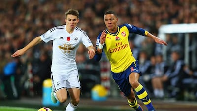 Kieran Gibbs , right, and Arsenal could not keep up with Tommy Carroll and Swansea City yesterday. Michael Steele / Getty Images