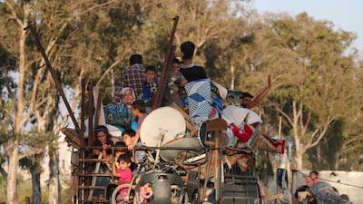 Residents return to the rebel-held town of Nawa, about 30 kilometres north of Deraa in southern Syria, on July 17, 2018. AFP
