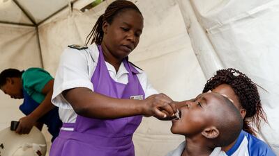 A young boy swallows a cholera vaccine after an outbreak of the disease in the Zimbabwean capital Harare in October. AFP