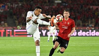 Real Madrid defender Eder Militao vies with Osasuna forward Ante Budimir. AFP