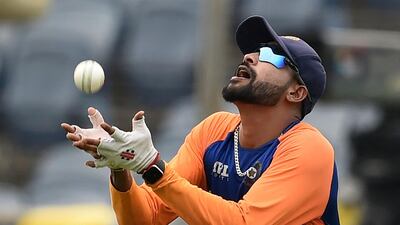 Pacer Mohammed Siraj catches a ball during practice. AFP