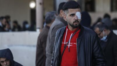 A Palestinian man waits by luggage at the Rafah border crossing. AFP