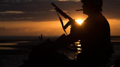 The silhouette of a WWII enthusiast sitting, as the sun rises, on a period motorcycle on the beach of Asnelles, in Normandy, during the D-Day commemorations marking the 75th anniversary of the World War II Allied landings in Normandy. AFP