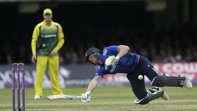 England’s Ben Stokes dives back to his wicket as he is hit by a throw by Australia’s Mitchell Starc and given out for obstructing the field at Lord's. Tim Ireland / AP Photo