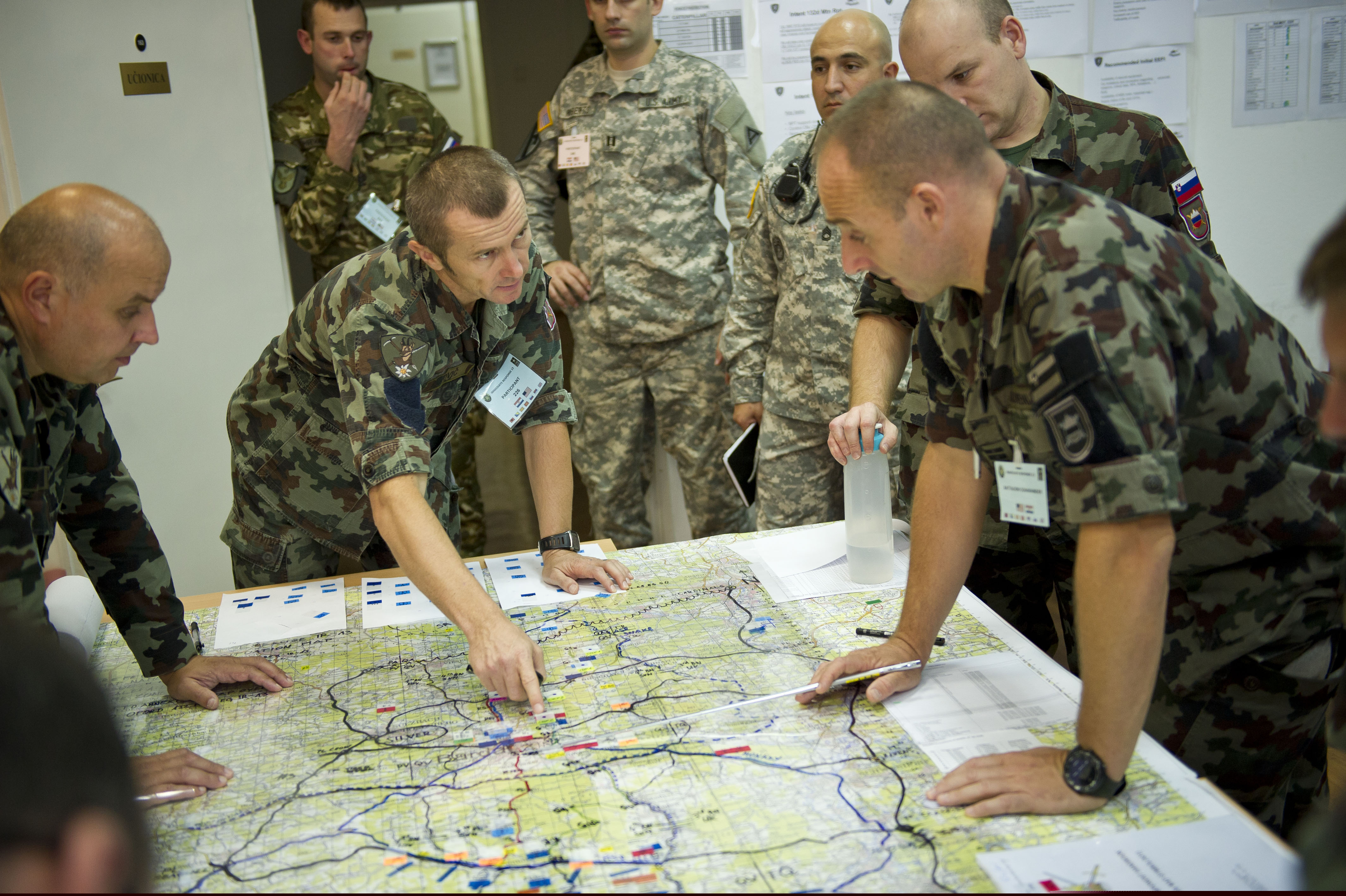 Slovenian soldiers review a map as US Army officers look on during Immediate Response 2013 in Zagreb, Croatia. Photo: US Army