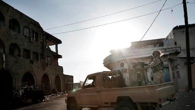 Saudi-led coalition backed forces patrol Mocha, Yemen. AP