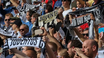 Juventus fans wave flags and show their support. Getty Images