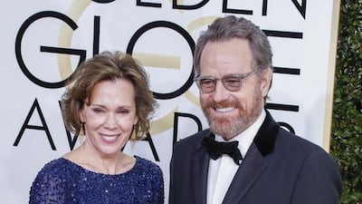 Robin Dearden, left, and Bryan Cranston arrive for the 74th annual Golden Globe Awards ceremony. Paul Buck / EPA