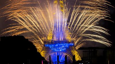 Fireworks illuminate the sky near the Eiffel Tower as part of the Bastille Day celebrations in Paris, France, on July 14, 2014. The Bastille Day, the French National Day, is held annually on July 14 to commemorate the storming of the Bastille fortress in 1789. Ian Langsdon / EPA