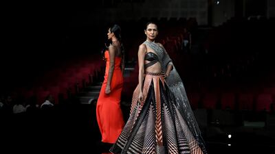 Models present colourful creations by designer Amit Aggarwal.