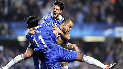 Alex, right, celebrates with teammates Didier Drogba and Michael Ballack after scoring against Liverpool.