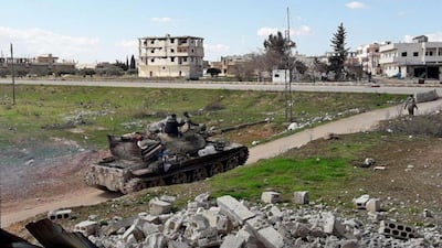 Syrian army soldiers in the town of Saraqib in Idlib. Hundreds of Bashar Al Assad’s loyalists appear to have perished in the ongoing campaign. AFP