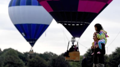 Spectators watch the balloons take to the sky. Getty Images