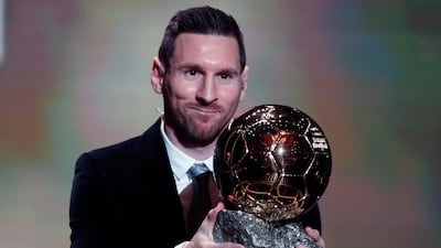 Barcelona's soccer player Lionel Messi holds the trophy of the Golden Ball award ceremony in Paris, Monday, Decemer 2, 2019. Messi won the Ballon d'Or for sixth time. AP Photo/Francois Mori