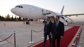 France's President Emmanuel Macron was greeted by Syria's Foreign Minister Asaad Al Shibani at Damascus International Airport. AFP