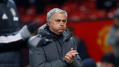 Manchester United manager Jose Mourinho keeps warm back in the UK. Action Images via Reuters / Jason Cairnduff