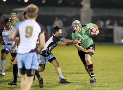 Stanislas Provot of Al Yasmina takes on the BSAK defence in the U19 boys match at Dubai Rugby Sevens. Chris Whiteoak / The National