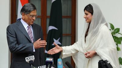 July 27 2011: Pakistan Foreign Minister Hina Rabbani Khar, right, shakes hands with Indian Foreign Minister S.M. Krishna, left, prior to a meeting in New Delhi. India suspended contacts with its arch-rival after the attacks and their peace dialogue has st???