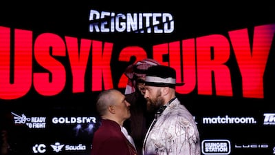 Oleksandr Usyk and Tyson Fury stare each other down. Reuters
