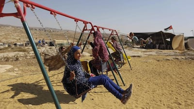 Palestinian children play in the village of Susiya, south of the West Bank city of Hebron. Majdi Mohammed / AP Photo