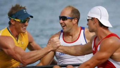 Ken Wallace, left, is congratulated by Tim Brabants, centre, and Adam van Koeverden.