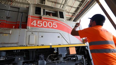 Engineers work on an Etihad Rail train at Al Mirfa. While freight is the immediate priority, passenger transport will become a key focus in years to come. AFP