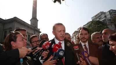 Journalists try to speak to Turkish President Recep Tayyip Erdogan in Istanbul. AFP