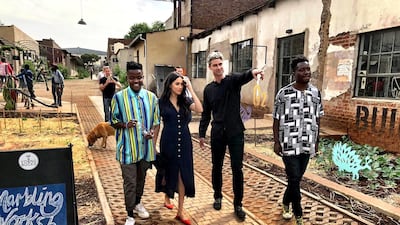 The royal wore an Aritzia dress and red slingbacks from Everlane. Reuters