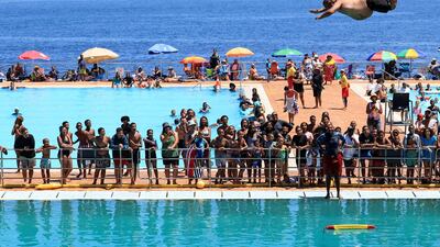 A man dives into Sea Point swimming pool in Cape Town, South Africa. Reuters