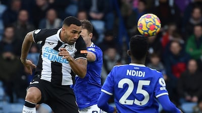Newcastle's Callum Wilson and Leicester's Jonny Evans challenge for the ball. AP