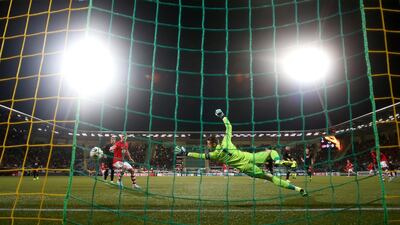 United's David De Gea dives to save the ball. Getty
