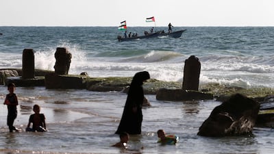 Palestinians ride boats during a protest against the Israeli blockade on Gaza, at the sea in Gaza. Reuters