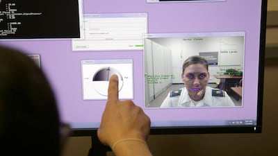 A computer monitors some of cadet Cheyenne Quilter's reactions as she works with a virtual reality character named "Ellie" at the US Military Academy at West Point, NY. AP